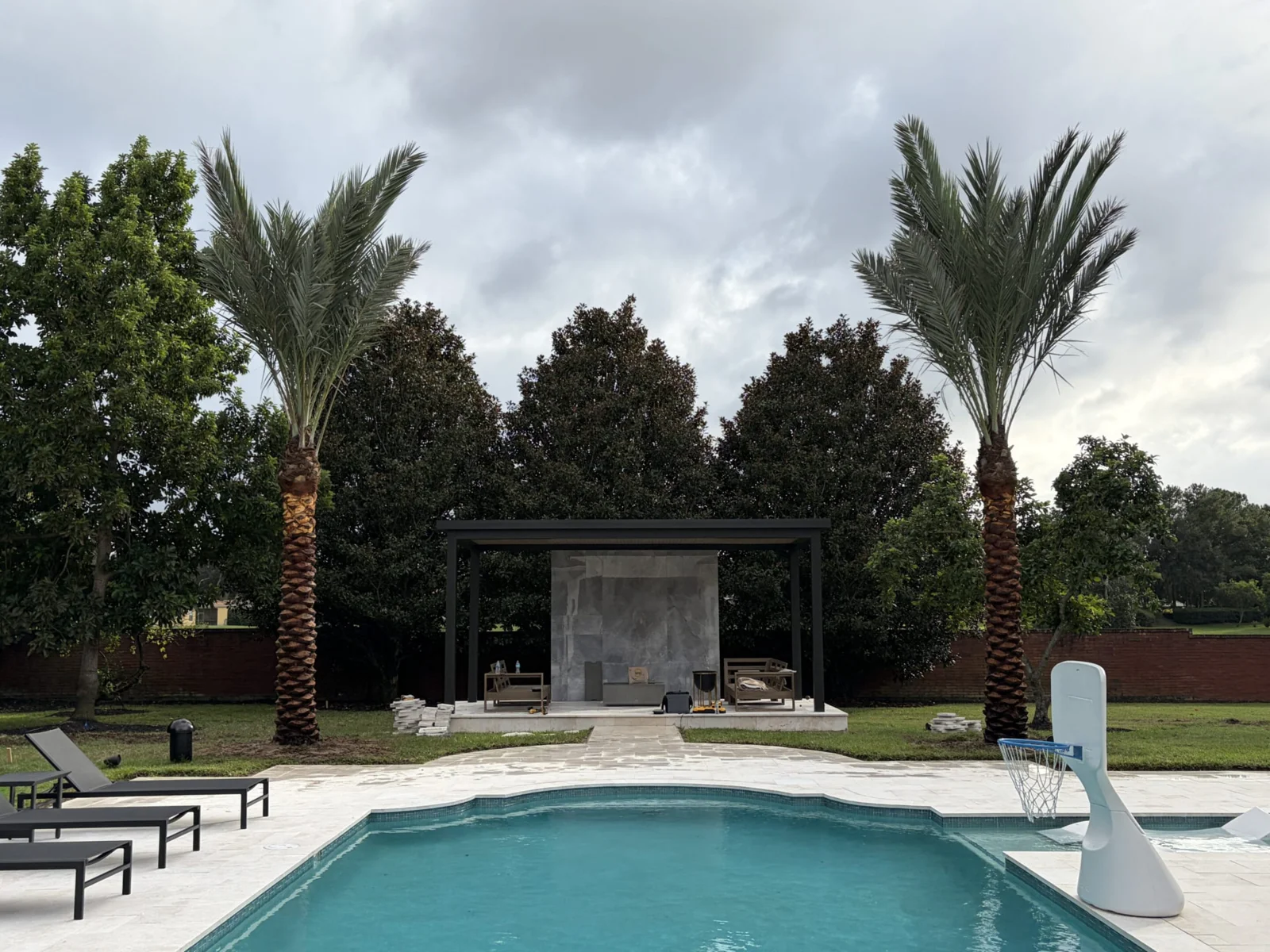 Palm trees framing a residential landscape and outdoor space.